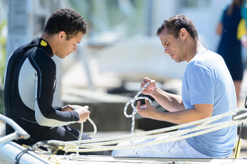 a male learning to sail