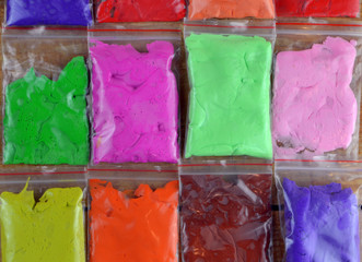 multicolored background made of air plasticine lying on the table