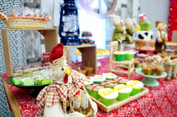 Child's birthday. Farm theme. Cake table with sweets and decoration