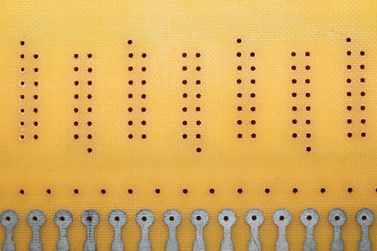 Dotted textolite surface. template for soldering the circuit. perforated texture