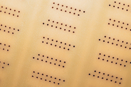 Dotted textolite surface. template for soldering the circuit. perforated texture