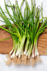 Fresh red and white onions on white background