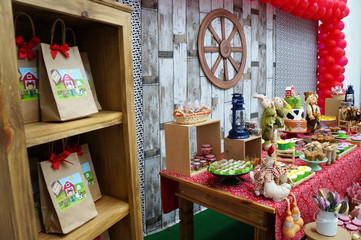 Child's birthday. Farm theme. Cake table with sweets and decoration