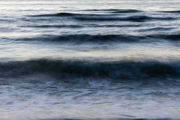 Waves crashing on the sea shore. Long exposure
