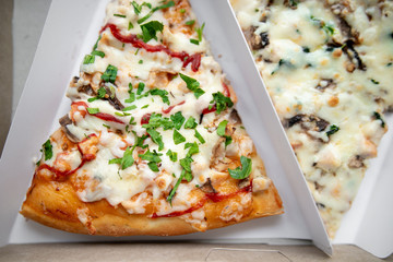 slice of delicious pizza delivered home