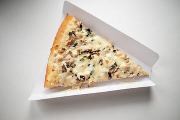 slice of delicious pizza delivered home