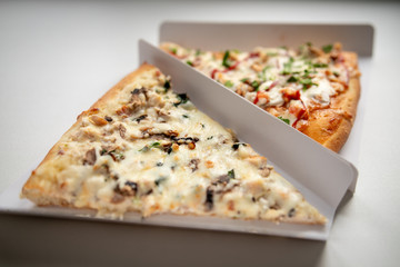 slice of delicious pizza delivered home