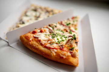 slice of delicious pizza delivered home