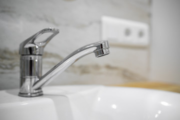 Bathroom interior with sink and faucet.