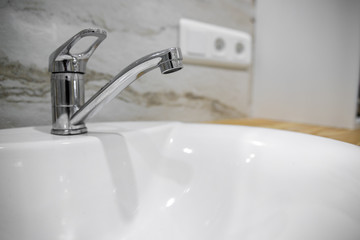 Bathroom interior with sink and faucet.