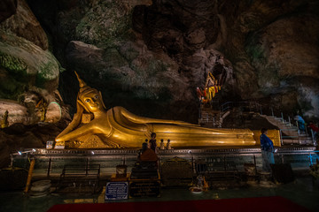Obraz premium Phuket, Thailand - February, 2020: Big Buddha's temple in a cave and monkey cave