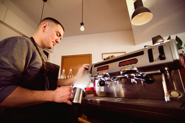 Barista hands making coffee cup with coffee machine in coffee shop