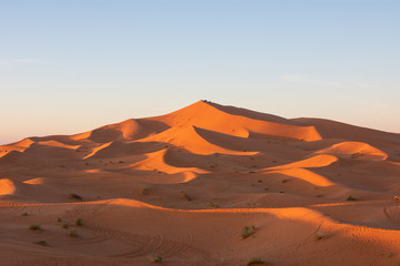 Naklejka na ściany i meble Huge Erg Chebbi dunes at the Sahara Desert in merzouga, Morocco