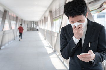 Asian man business in city of thailand,Handsome man wearing protection medical mask covid-19 or coronavirus from Infected person,corona protected Help protect For world and people stop virus warning