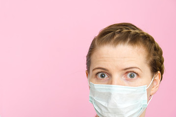 woman wearing medical mask. Masked woman - protection against influenza virus. ear with protective face mask at home. Stop the virus and epidemic diseases. stop coronavirus. on pink background.