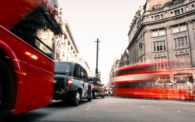 Motion blurred view of busy London street traffic