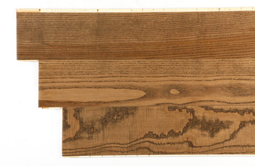 A close-up on walnut wood plank laminate flooring pattern on white background.