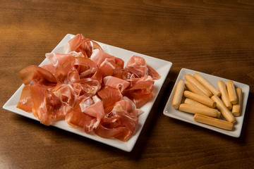 typical spanish food plate of iberian ham with croutons