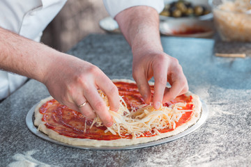 Cooking pizza in the oven by a restaurant chef