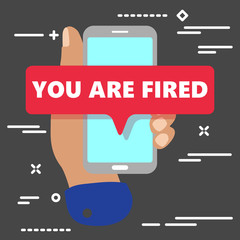 Word writing text You Are Fired  with mobile phone concept on dark background. Business concept for Getting out from job