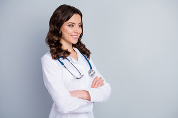 Profile photo of beautiful family doc lady patients consultation beaming smiling virology clinic arms crossed look empty space wear lab coat stethoscope isolated grey color background