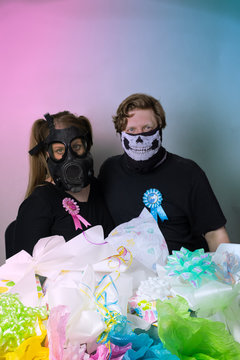Woman Wearing Gas Mask With Man In Skull PPE For Virtual Baby Shower Party During COVID-19 Coronavirus Pandemic Quarantine Lockdown