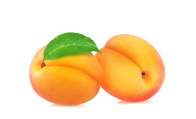 Fresh apricots with leaves isolated on white background with clipping path