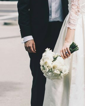 High Angle View Of Couple Holding Bouquet