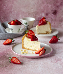 Cheesecake pieces decorated with fresh strawberries