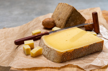 Fototapeta premium French cheese Comte, three varieties 1 year matured Prestige, fruity flavoured Fruite and Vieille Reserve