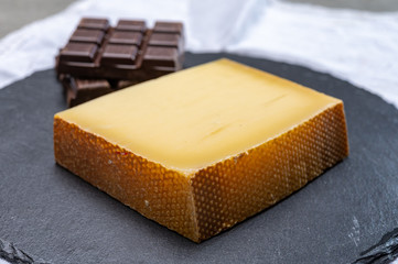 Block of Swiss medium-hard matured cheese gruyere used for baking, quiche, fondue, sandwiches