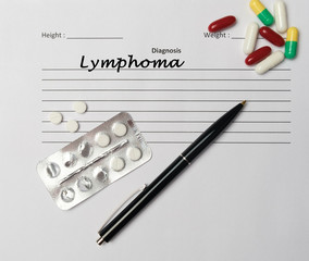 Lymphoma diagnosis written on a white piece of paper.
