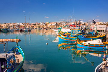 Obraz premium Fishing boats in the Mediterranean Village of Marsaxlokk, Malta