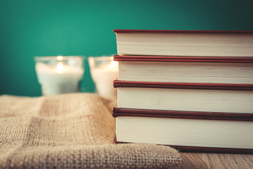 Books on wooden shelf with vintage backgrounds