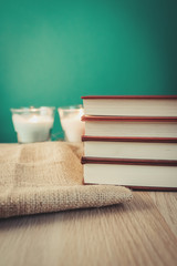 Books on wooden shelf with vintage backgrounds