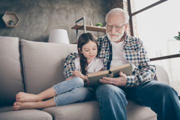 Photo of aged old grandpa little pretty granddaughter sit comfy sofa hugging stay house quarantine...