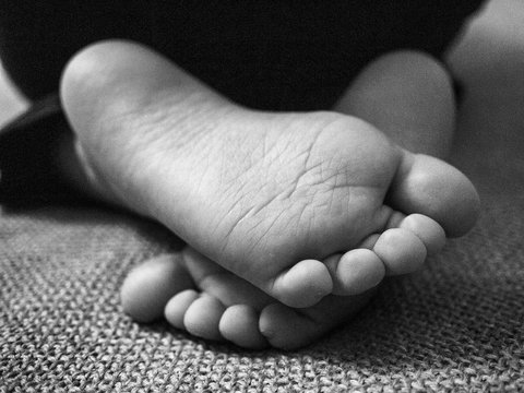 Close-up Of The Feet Of A Child
