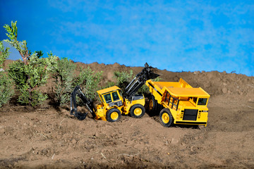 diorama maqueta juguete construcción con tirra y arboles 