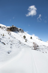 Fototapeta na wymiar Snowy mountain with blue sky