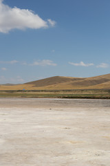 Panoramic view of a desert landscape with mountains in the background