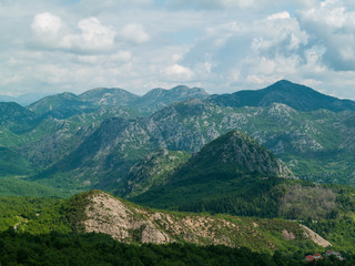 Montenegro mountains landscape with peaks covered with green forests 