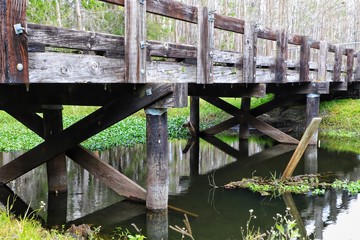 Old wooden bridge over river