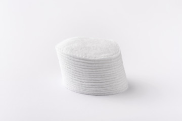 Fototapeta na wymiar Cotton disks are stacked on a white background