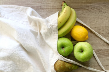 Various fruit in a canvas tote bag. Top view.