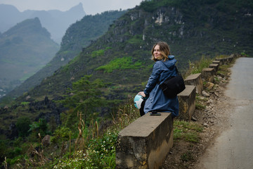 Naklejka na ściany i meble bakpacker young woman traveling through northern vietnam.