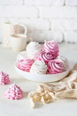 Homemade gentle apple and berry marshmallows on a white plate. Homemade healthy sweets. A lot of handmade marshmallow. natural marshmallow marshmallows