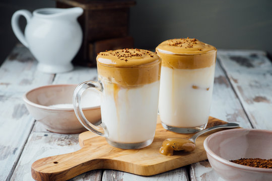 Dalgona Coffee Or Whipped Coffee Drink With Milk On Wooden Table