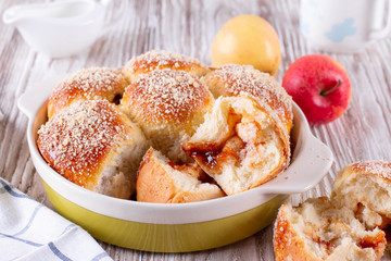 Homemade bun with crumb and jam. Bun with crumb. Bun sprinkled with crumbs.