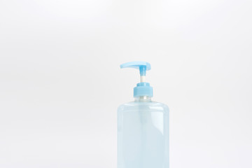 Isolated blue alcohol gel bottle and pump on white background.