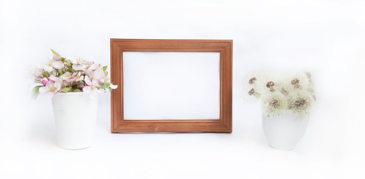 A portrait frame with white flowers in a jug and a print next to the frame that overlaps your quote, promotion, headline or design, great for small businesses, bloggers.